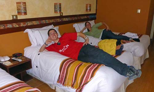 Missionary family on bed in Taypicala Hotel