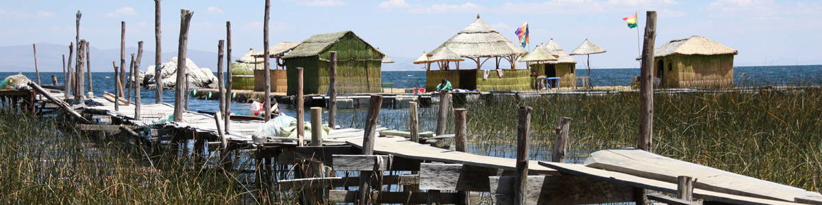 Wooden bridge and huts at Lake Titicaca