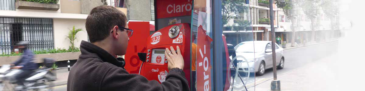 Missionary talking on pay phone in Peru