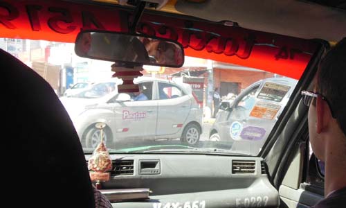 View of snarled traffic from inside taxi