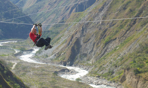 Missionary riding zipline in Peru